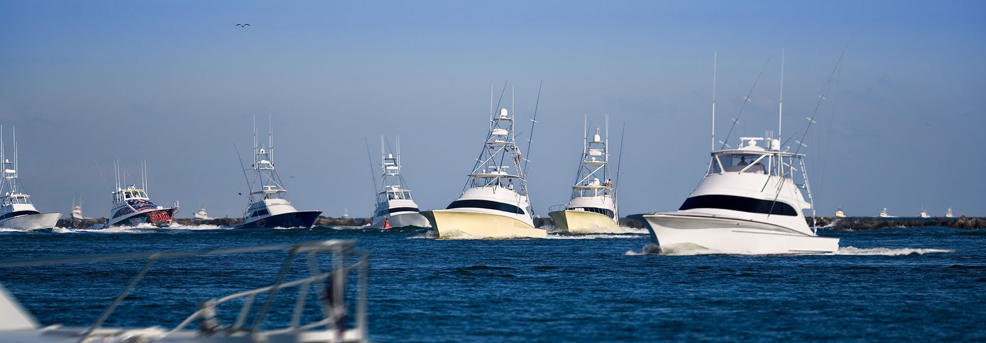 multiple offshore fishing boats in ocean city inlet