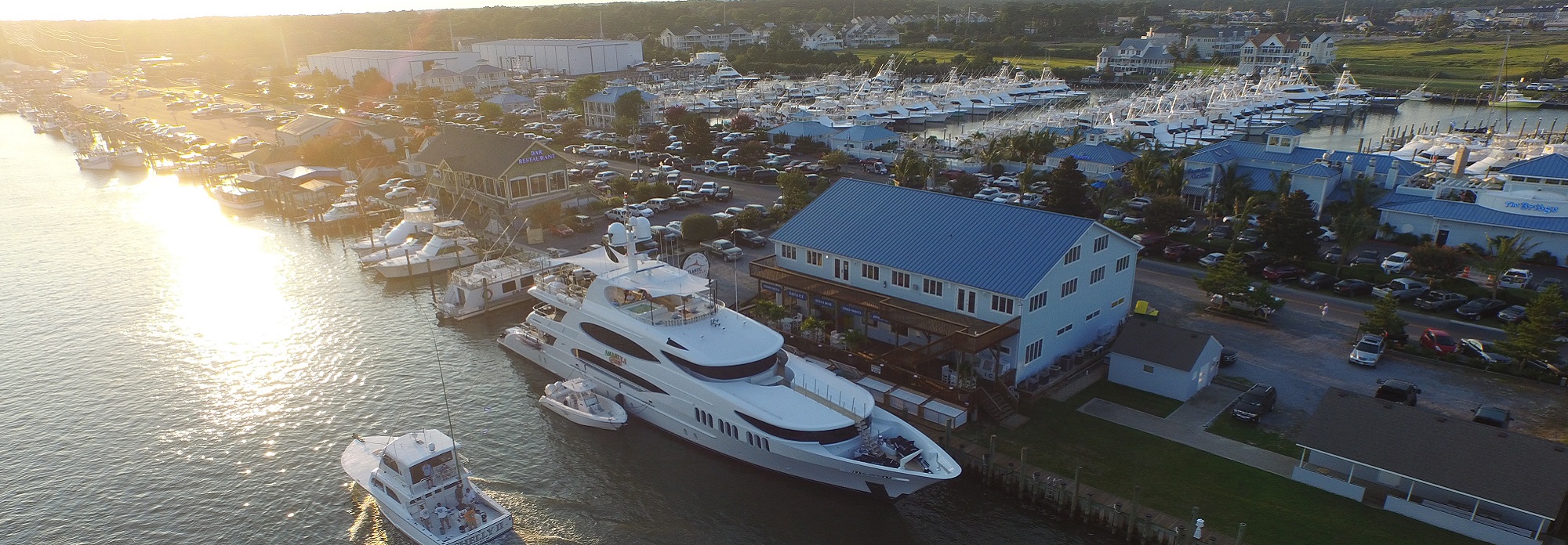 Aerial image of a yacht behind Atlantic Tackle OCMD